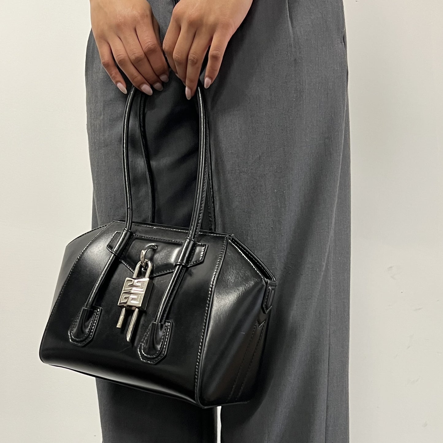 Antigona Lock Mini Leather Bag in Black