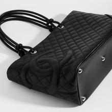 Load image into Gallery viewer, Top view of the CHANEL Cambon Ligne Tote in Black Leather