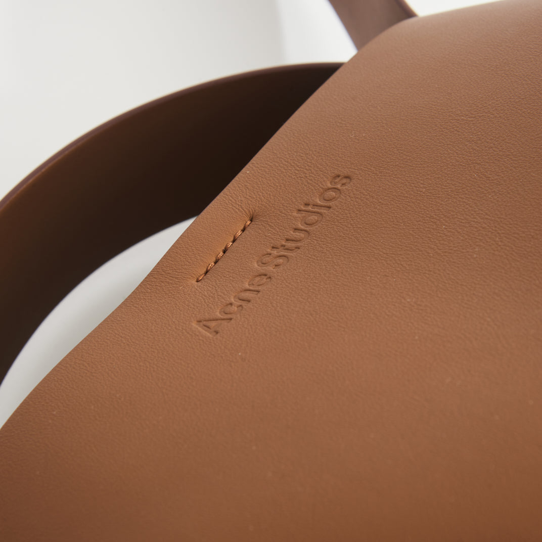 Musubi Mini Knotted Leather Crossbody Bag in Tan