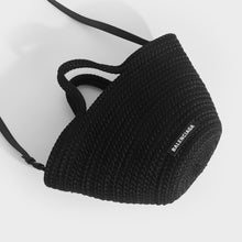 Load image into Gallery viewer, Flat shot of Balenciaga Ibiza nylon and leather basket bag in black