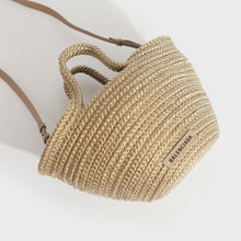 Load image into Gallery viewer, Flat view of Balenciaga Ibiza nylon and leather basket bag in beige