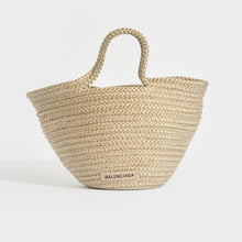 Load image into Gallery viewer, Front view of Balenciaga Ibiza nylon and leather basket bag in beige