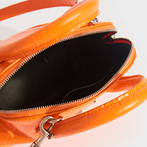 Inside view of Balenciaga XXS ville embossed leather tote in orange