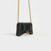 Load image into Gallery viewer, Side view of the BALENCIAGA Hourglass Chain Bag in Black