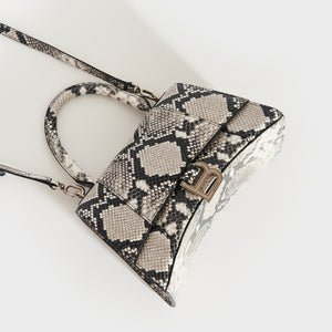 Top down view of the BALENCIAGA Small Hourglass Top Handle Bag in Python Print