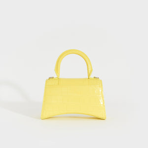 Rear view of the BALENCIAGA XS Hourglass Top Handle Bag in Light Yellow Embossed Croc