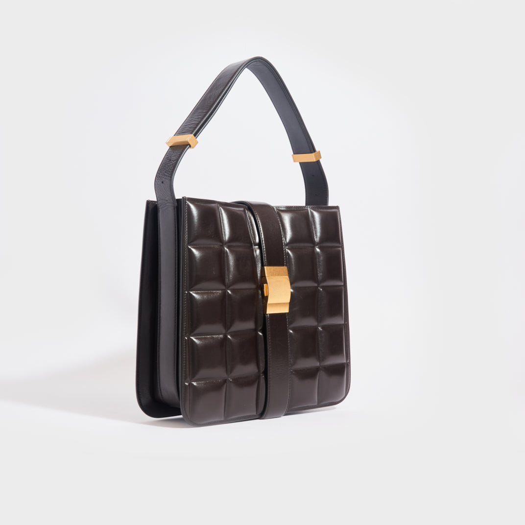 Side view of the BOTTEGA VENETA The Padded Marie Leather Shoulder Bag in Fondente