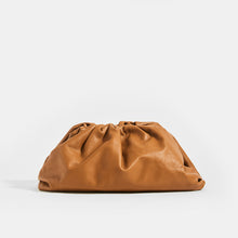 Load image into Gallery viewer, Front view of the BOTTEGA VENETA The Pouch Leather Clutch in Cammello