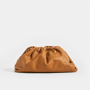 Front view of the BOTTEGA VENETA The Pouch Leather Clutch in Cammello