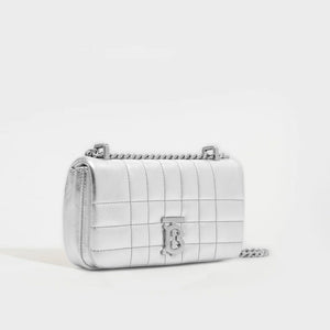Side view of the BURBERRY Mini Quilted Leather Lola Bag in Metallic Silver