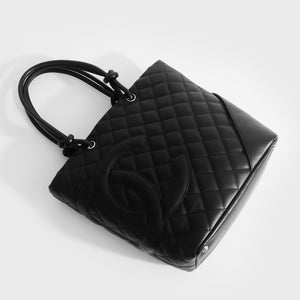 Top view of Chanel cambon ligne diamond quilted tote bag in black leather from 2003-2004