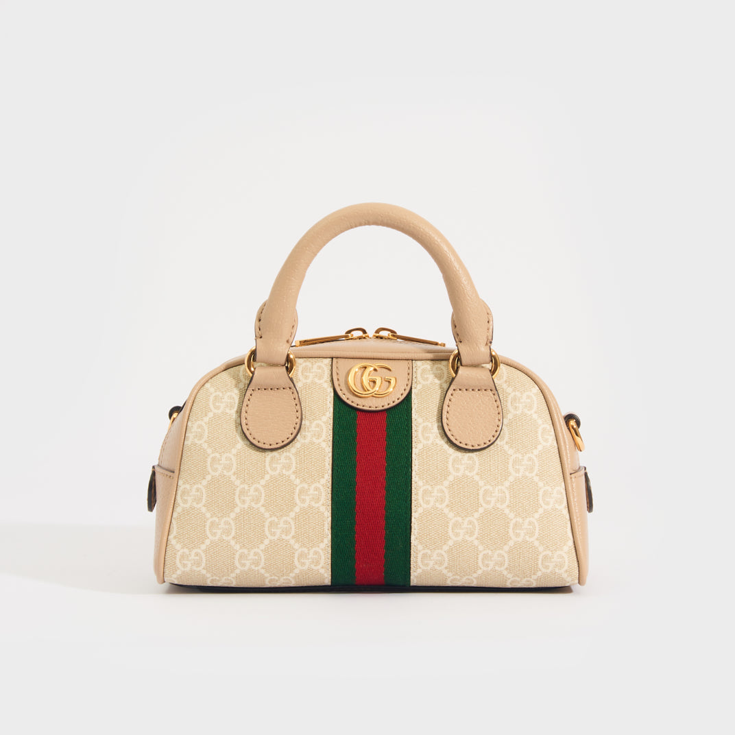 Front view of the GUCCI Ophidia Mini GG Top Handle Bag in Beige and White GG Supreme Canvas