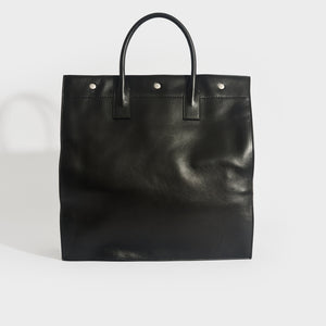 Back view of Saint Laurent Rive Gauche tote bag in black leather and silver hardware