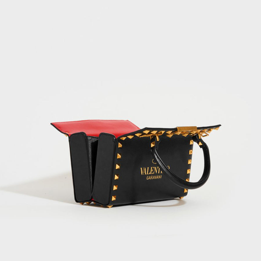 Black Rockstud leather clutch bag, Valentino Garavani