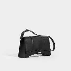 Side view of the BALENCIAGA Hourglass Baguette Grained Leather Shoulder Bag