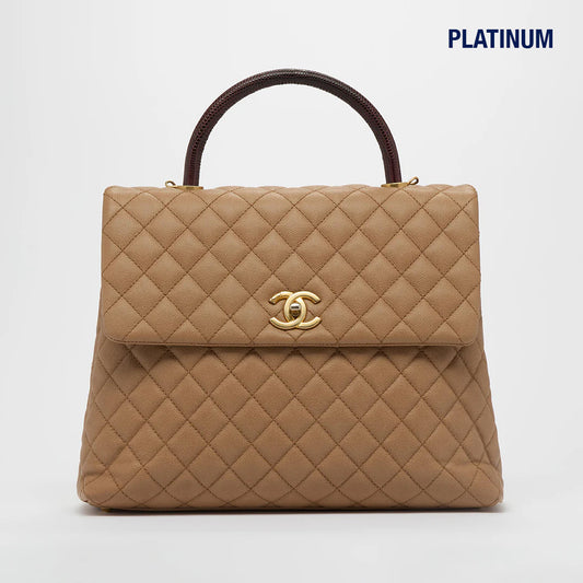 Coco Caviar Top Handle Bag in Beige