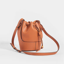 Load image into Gallery viewer, Side view of the LOEWE Balloon Small Bucket Bag in Tan Leather