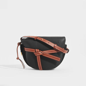 Front view of the LOEWE Gate Small Crossbody in Black with Brown Leather Trim and shoulder strap