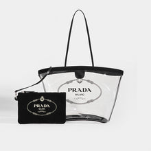 Load image into Gallery viewer, Front view of PRADA PVC Clear Logo-Print Tote in Clear/Black with detachable pouch