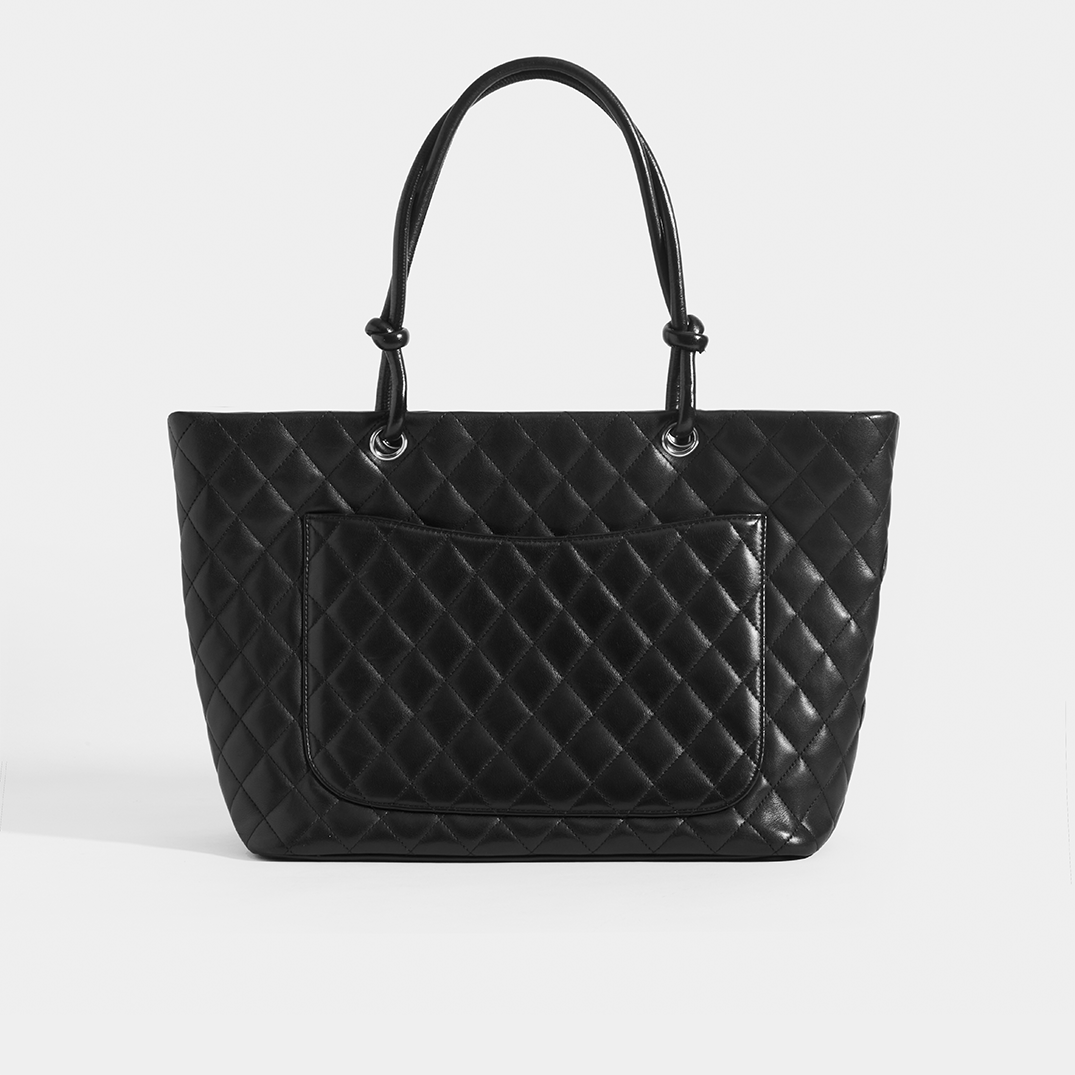 Rear view of the CHANEL Vintage Cambon Ligne Tote in Black Leather with outside pocket