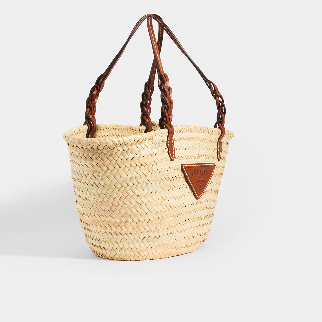 Side view of Prada natural fibre and brown leather detailing basket bag.