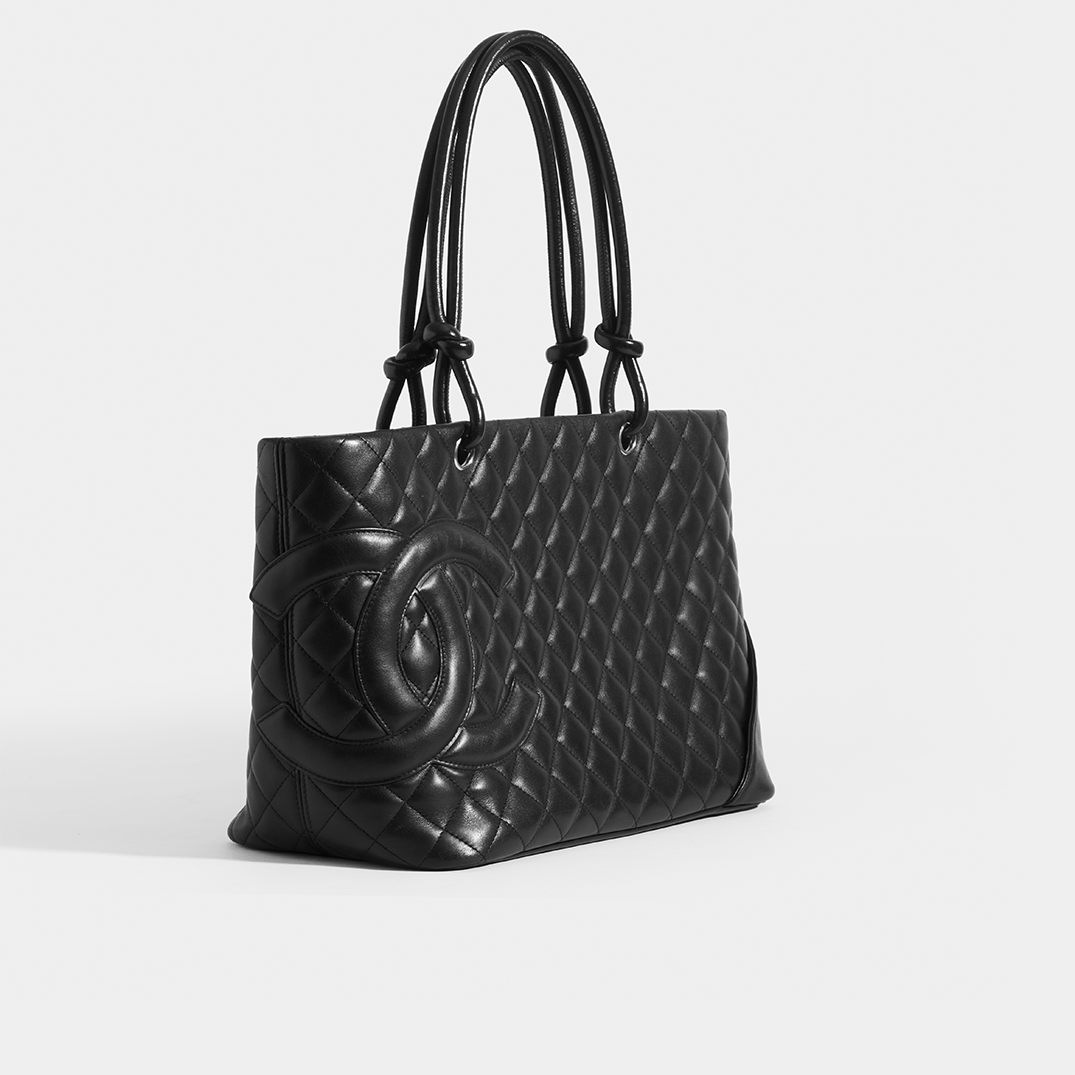 Side view of the CHANEL Cambon Ligne Tote in Black Leather