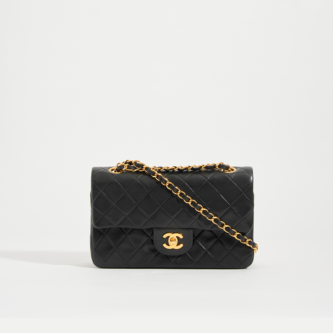 CHANEL. Timeless bag in black quilted lamb leather. Gol…