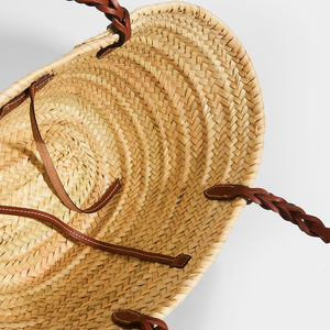 Inside view of Prada natural fibre and brown leather detailing basket bag.