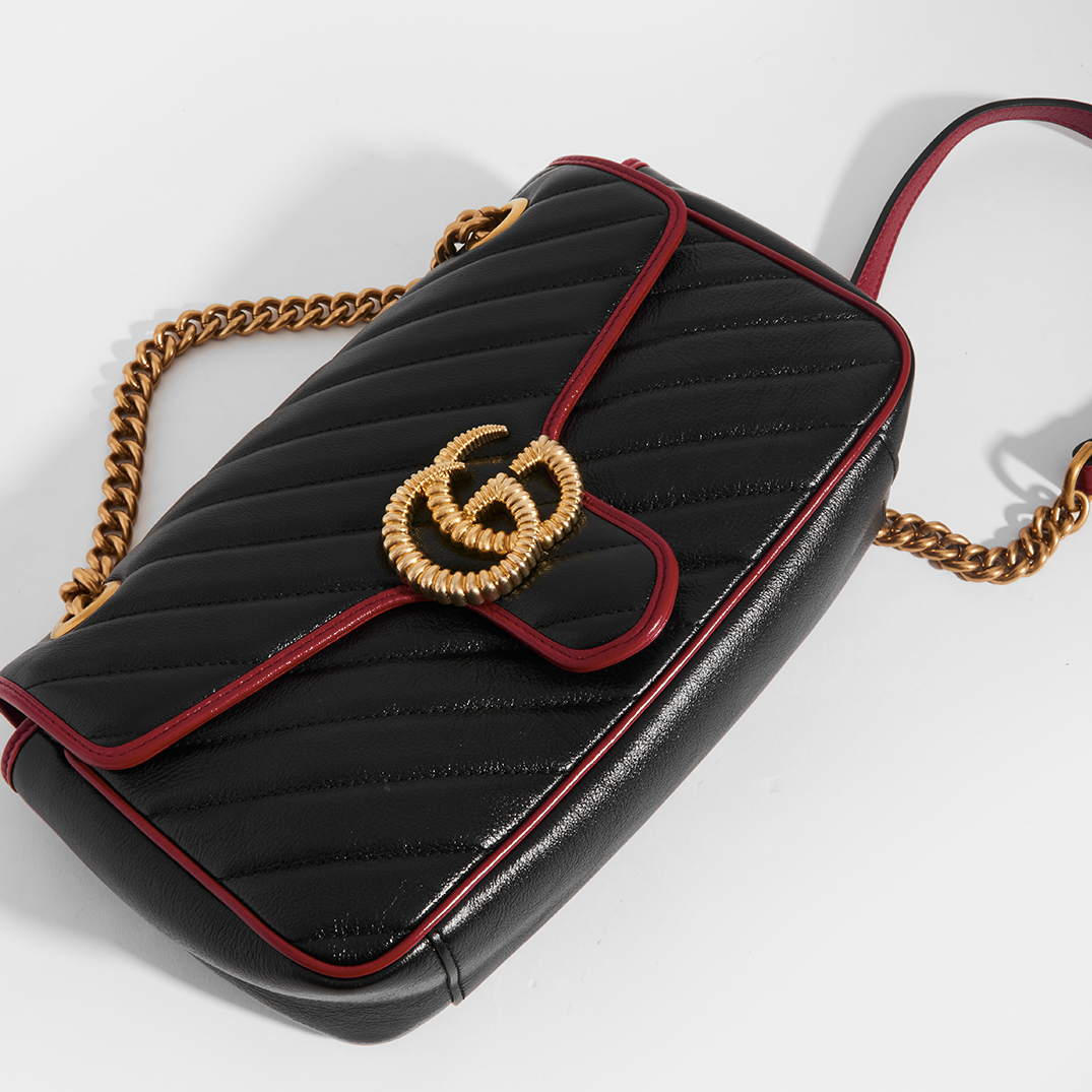 Front view of Gucci Marmont Small Shoulder Bag with Red Trim in Black Chevron Leather