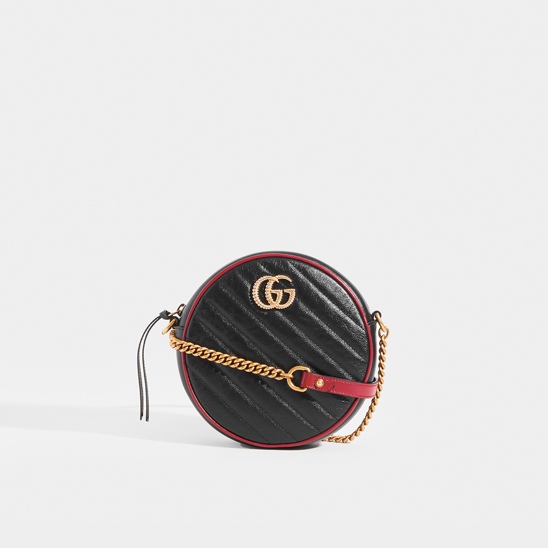 Front view of Gucci GG Marmont Mini Round Shouder Bag in Black Leather with Red Trim and Gold chain strap