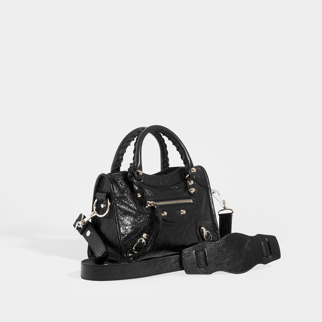 Side view of BALENCIAGA Mini City Bag With Silver Hardware in Black Leather and Shoulder Strap