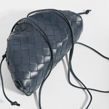 Load image into Gallery viewer, Top view of BOTTEGA VENETA Pouch 20 Intrecciato Crossbody in Deep blue Leather