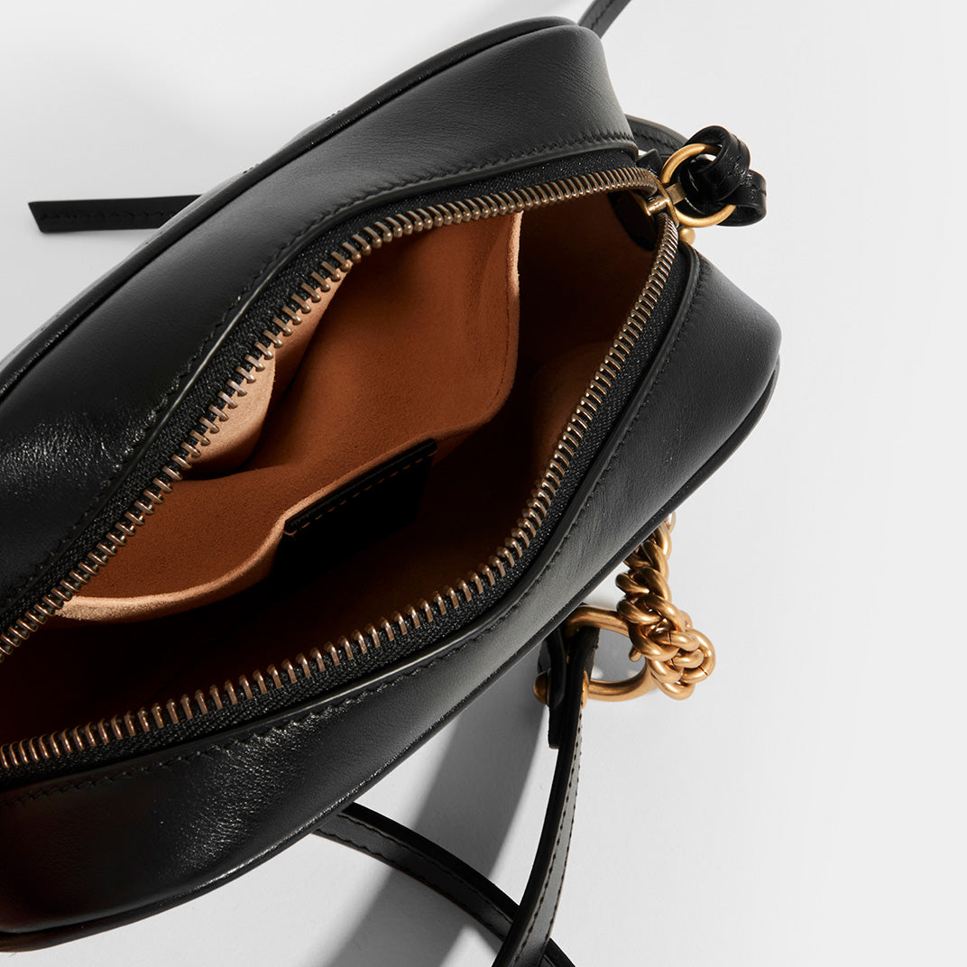 Inside view of GUCCI GG Marmont Matelasse Mini Crossbody in Black Leather With Gold Metal Chain Crossbody Strap with interior pocket