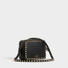 Load image into Gallery viewer, Side view of VALENTINO Rockstud Leather Camera Bag in Black