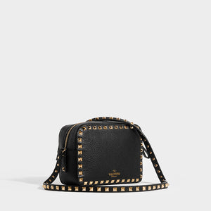 Side view of VALENTINO Rockstud Leather Camera Bag in Black