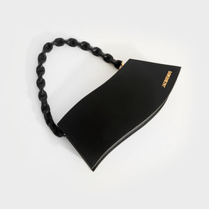 Flat shot of Jacquemus La Vague shoulder bag in black leather