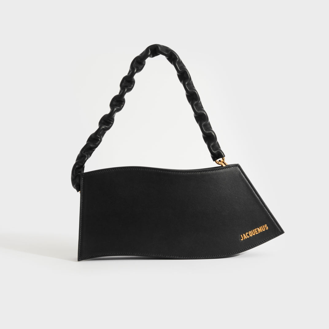 Front view of Jacquemus La Vague bag in black leather with gold hardware
