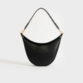 Front view of Loewe Luna shoulder bag in black leather and gold hardware.
