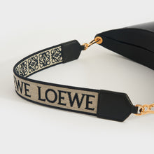 Load image into Gallery viewer, Detailed view of canvas logo strap of Loewe Luna shoulder bag in black leather