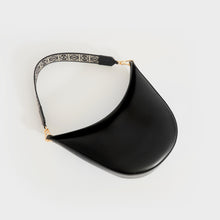 Load image into Gallery viewer, Flat shot of of Loewe Luna shoulder bag in black leather and gold hardware with canvas logo print shoulder strip