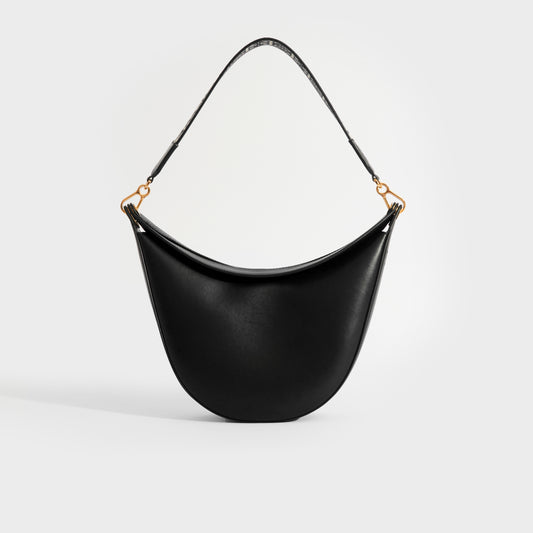 Back view of Loewe Luna shoulder bag in black leather and gold hardware.