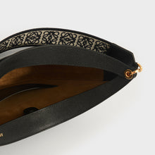 Load image into Gallery viewer, Inside view of Loewe Luna leather shoulder bag in black leather and beige suede lining. 