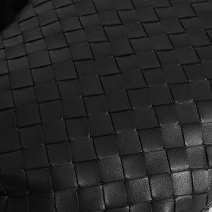 Detailed shot of Bottega Veneta Jodie Intercciato knotted shoulder bag showing intercciato craftmanship. 