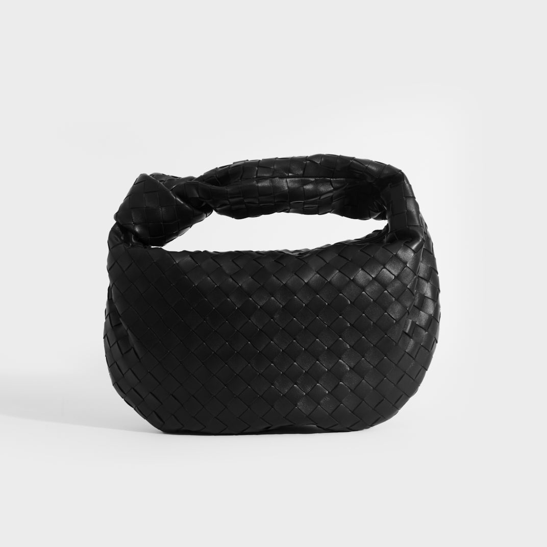 Front view of Bottega Veneta Jodie intercciato knotted shoulder bag in black leather.