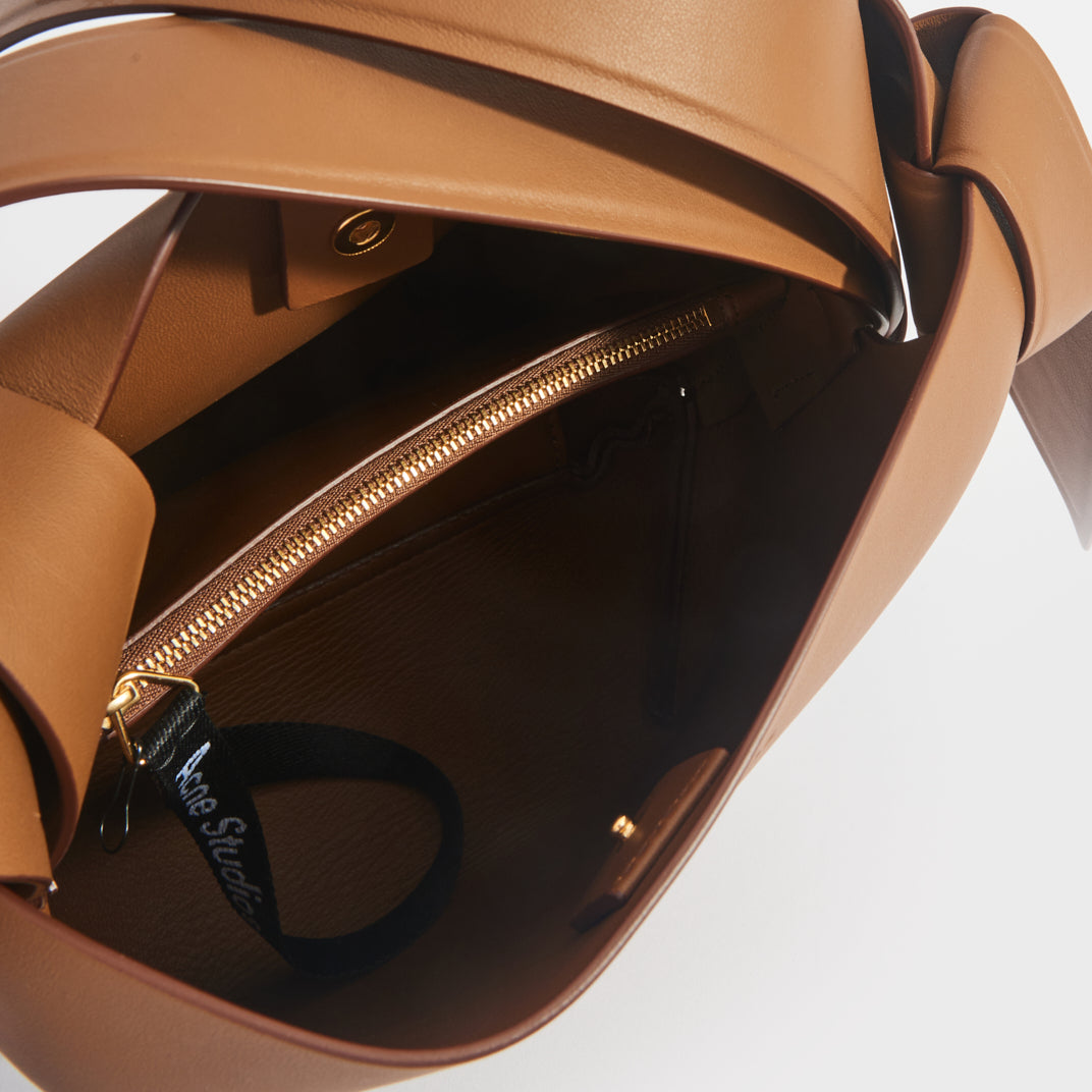 Musubi Mini Knotted Leather Crossbody Bag in Tan