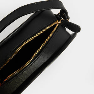 Zip and inside view of APC Half Moon Saffiano Leather Crossbody in Black