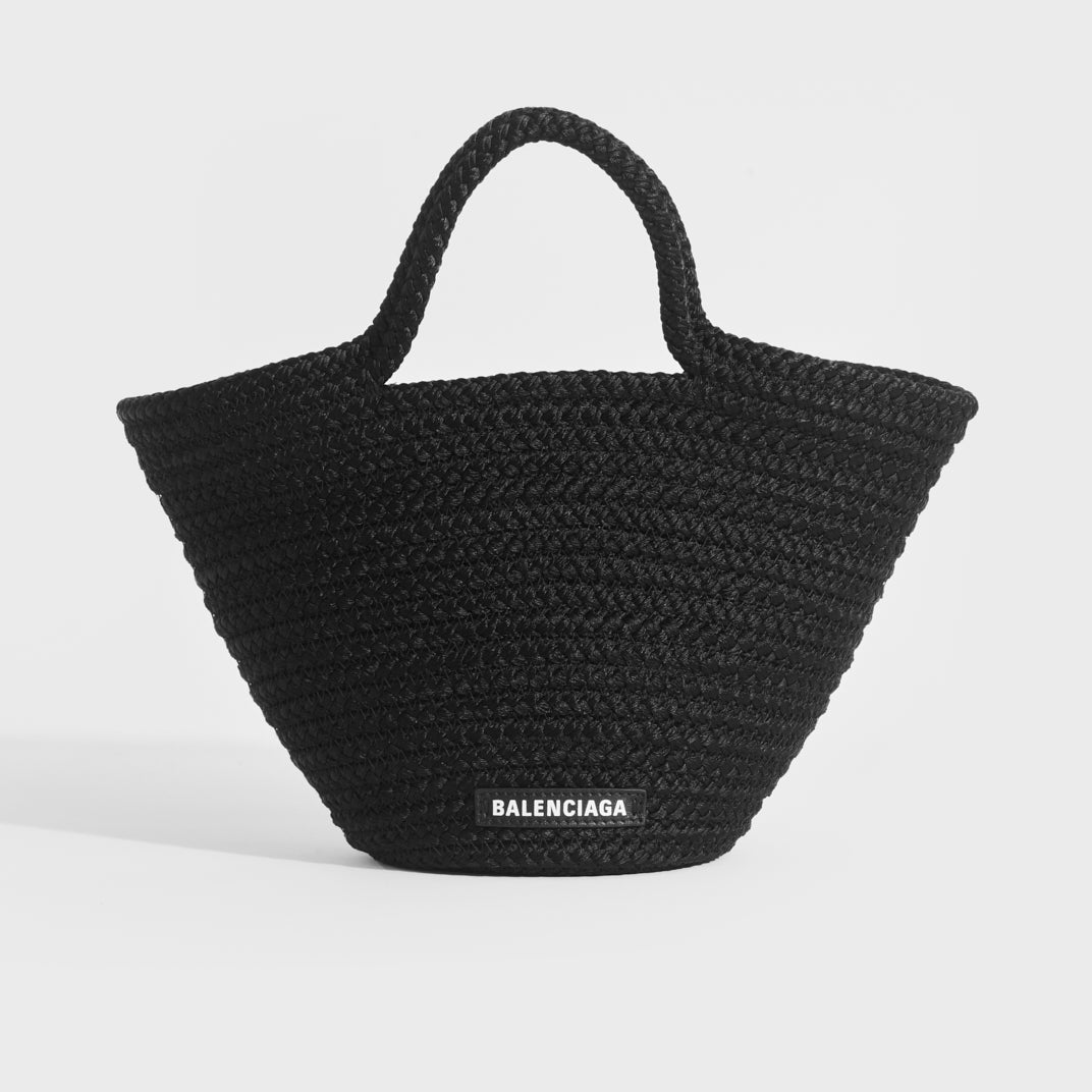 Front view of Balenciaga Ibiza nylon and leather basket bag in black