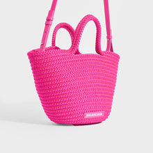 Load image into Gallery viewer, Side view of Balenciaga Ibiza nylon and leather basket bag in pink