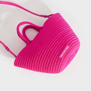 Flat view of Balenciaga Ibiza nylon leather basket bag in pink