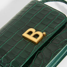 Load image into Gallery viewer, Close up detail of gold B hardware on BALENCIAGA B Small Bag in Croc-Embossed Calfskin